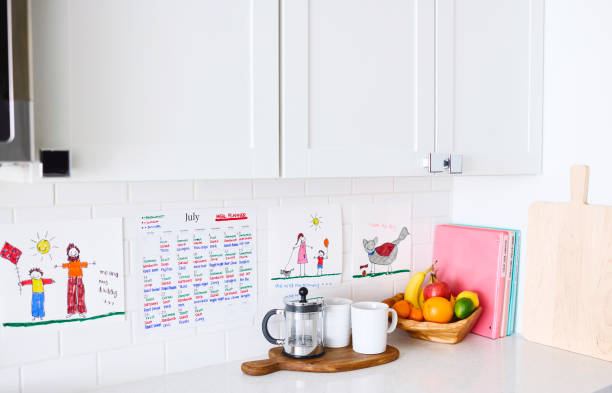 Calendar with marked workout days on a kitchen counter
